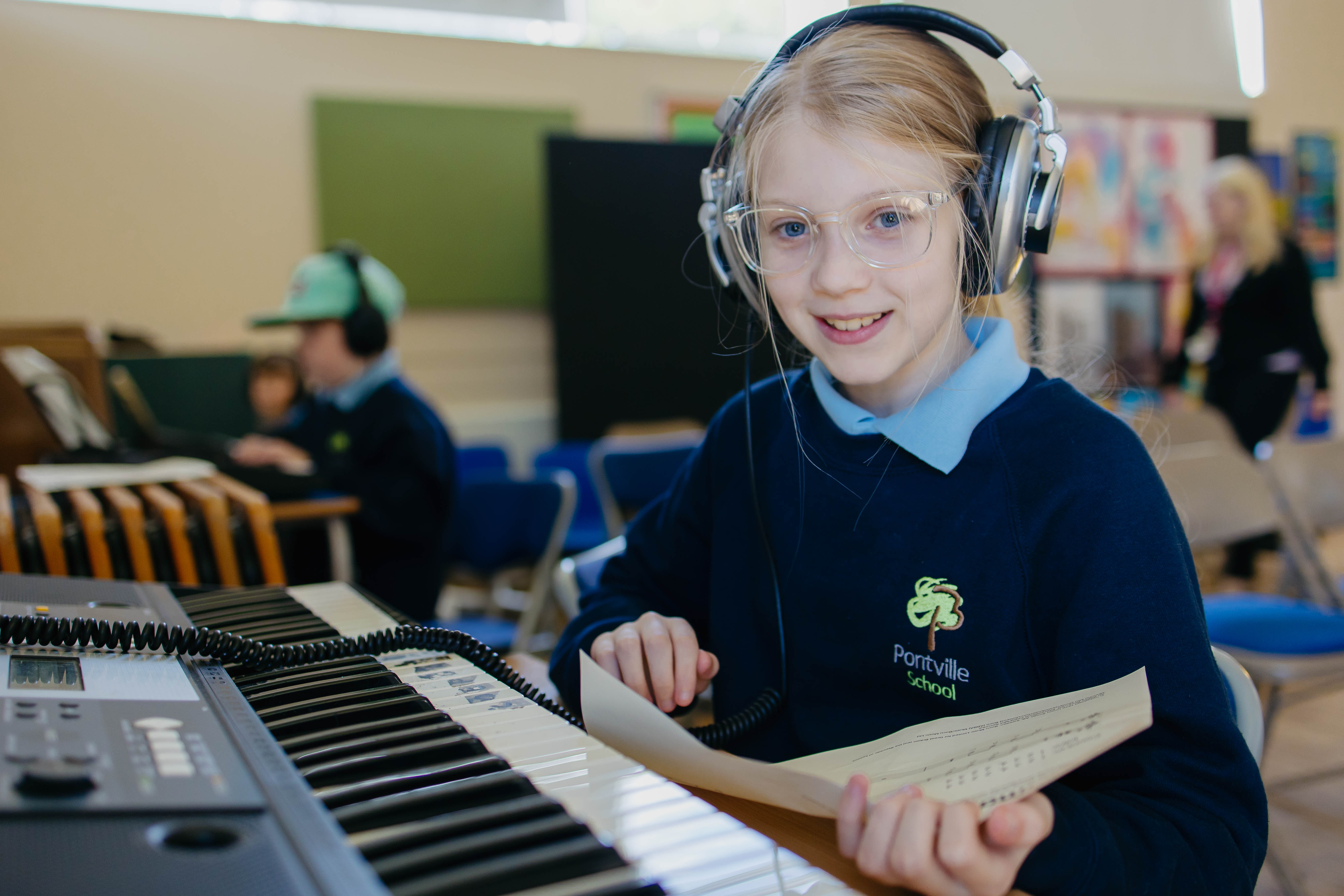 Young girl from Pontville School playing piano